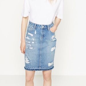 Denim distressed midi skirt.
